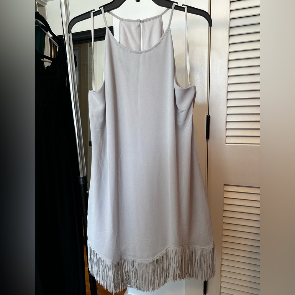New without tags never worn boutique grey slip dress lined with fringe size L